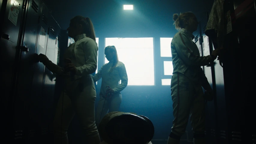 a group of people standing next to each other in a room, an album cover, unsplash, cyberpunk women, fencing, high resolution movie still, shipgirls