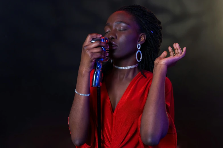 a woman in a red dress singing into a microphone, by Winona Nelson, pexels, photorealism, adut akech, blue mood, high quality photo, 15081959 21121991 01012000 4k