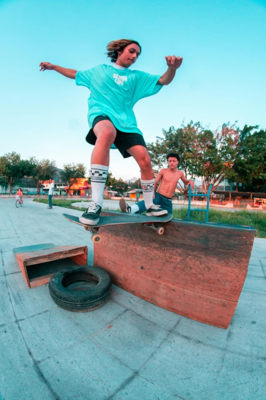 a man riding a skateboard on top of a wooden ramp, pablo carpio and jordan grimmer, slide show, real image