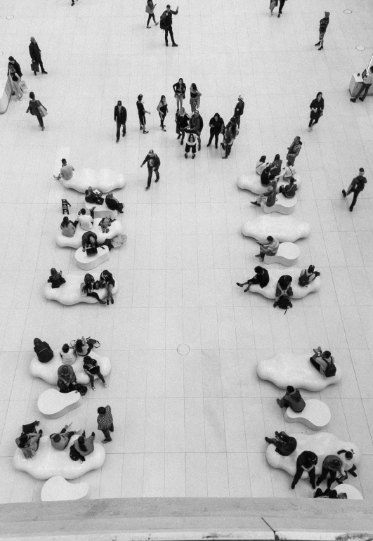 a black and white photo of a crowd of people, inspired by Andreas Gursky, pexels contest winner, conversation pit, white concrete floor, sculptural, mall