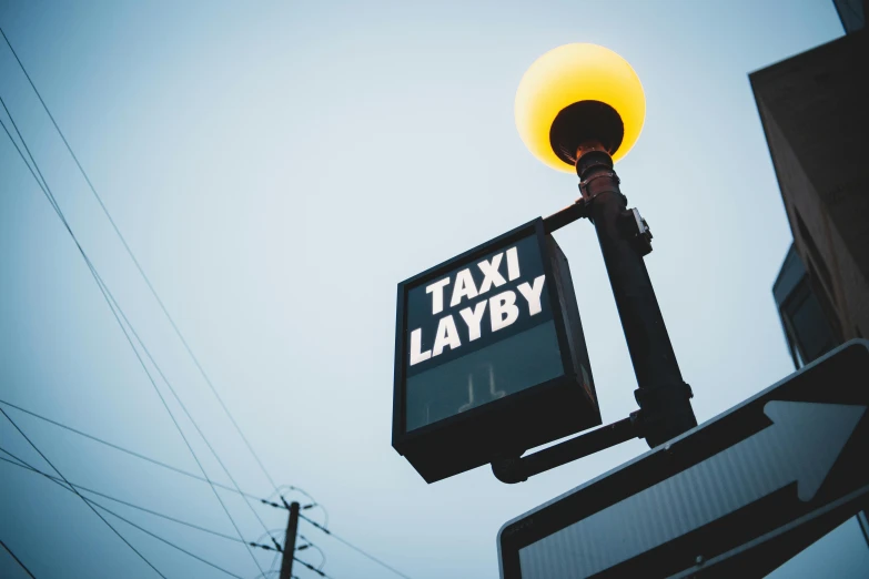 a street sign with a light on top of it, taxis, labirynth, pixvy, lazy