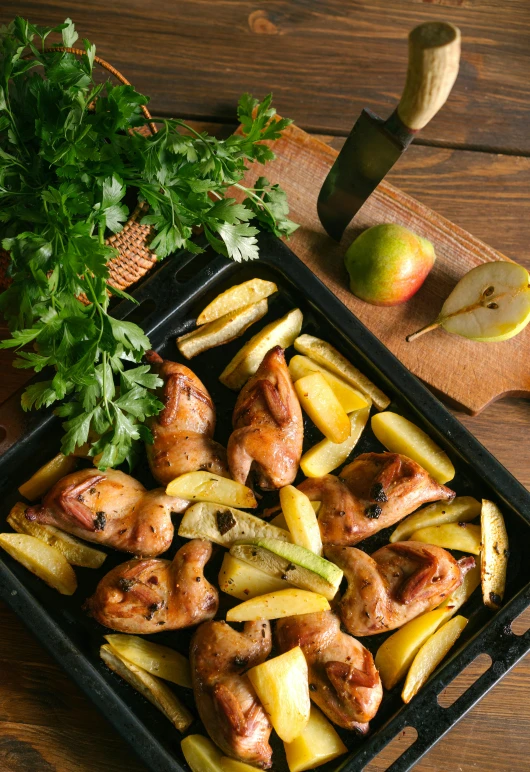 a tray of food sitting on top of a wooden table, a picture, by Julia Pishtar, shutterstock, chicken, yellow apples, lomo saltado, square