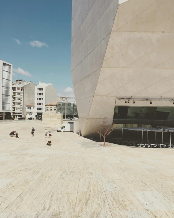 a man riding a skateboard up the side of a building, by Alejandro Obregón, unsplash contest winner, brutalism, photo of a big theaterstage, lgbtq, portugal, in a city square