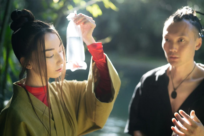 a couple of women standing next to each other, inspired by Fu Baoshi, pexels contest winner, gutai group, holding flask in hand, avatar image, on location, [ theatrical ]