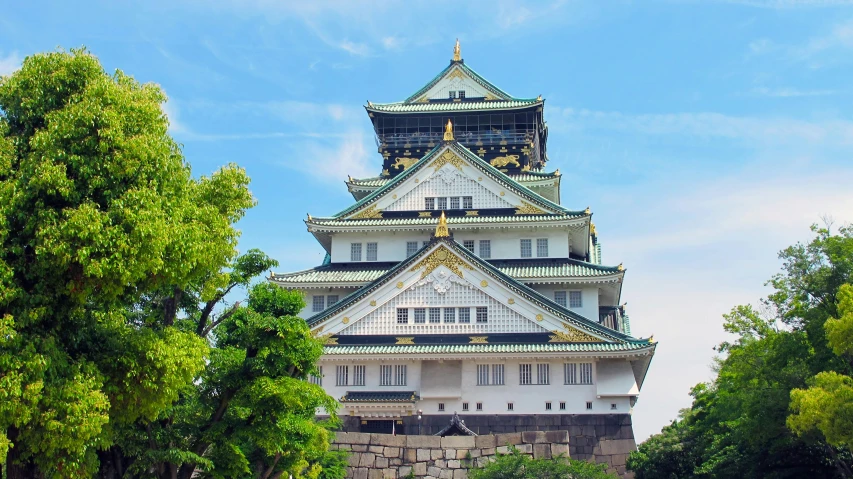 a tall white and green building surrounded by trees, inspired by Tawaraya Sōtatsu, unsplash, turrets, profile image, japan 1980s, front closeup