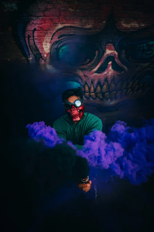 a man in a dark room with smoke coming out of his mouth, an airbrush painting, pexels contest winner, shock art, glowing red skull, with haunted eyes and glasses, blue and purple vapor, instagram post