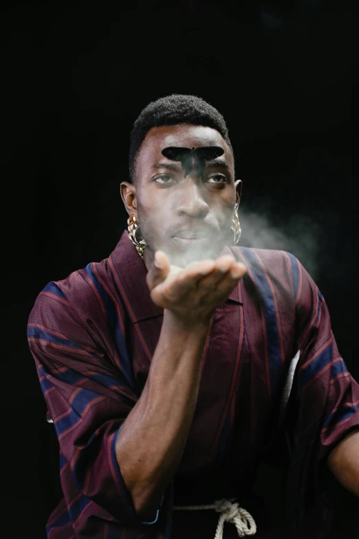 a man with smoke coming out of his mouth, an album cover, inspired by Godfrey Blow, trending on pexels, afrofuturism, beans in his eyes sockets, mkbhd, hand on cheek, playboi carti