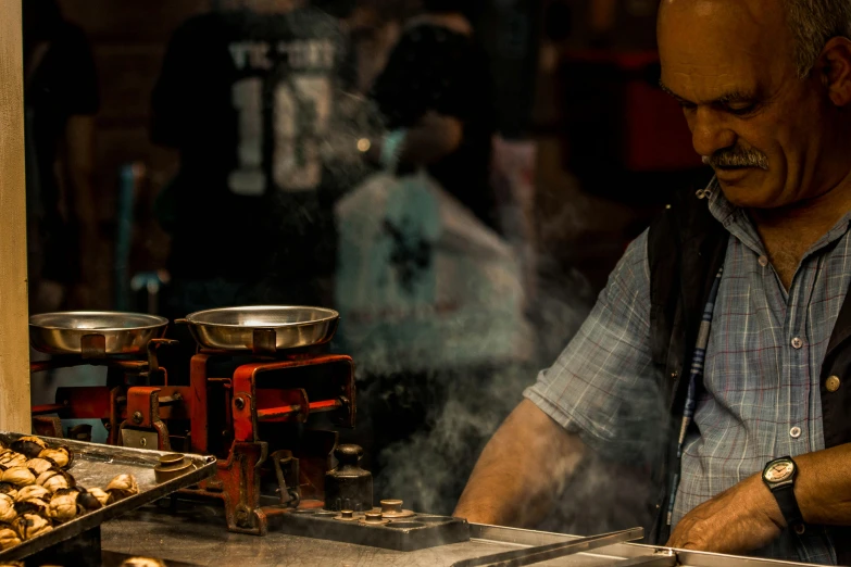 a man that is standing in front of a grill, a tilt shift photo, pexels contest winner, process art, steamed buns, aussie baristas, smokey cannons, closeup of a butcher working