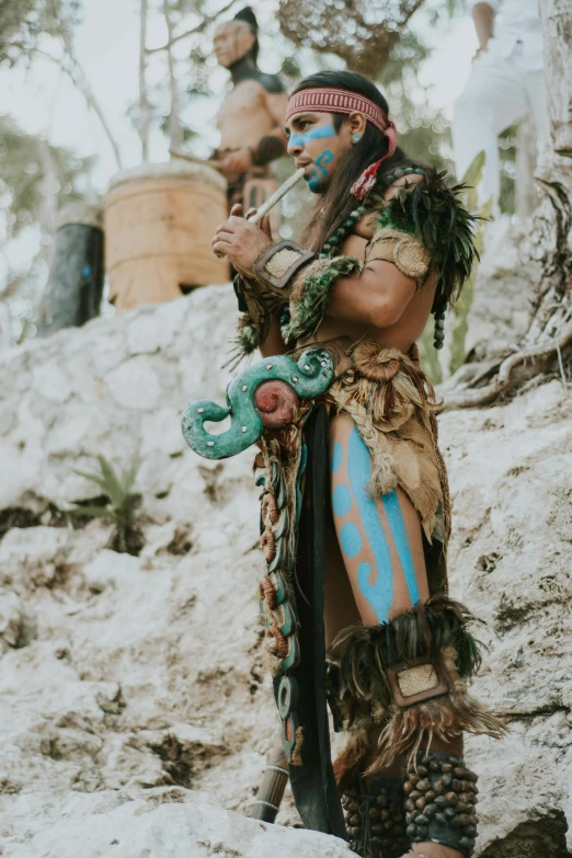 a man that is standing in the dirt, azctec warrior, ornate cosplay, medium-shot, #trending