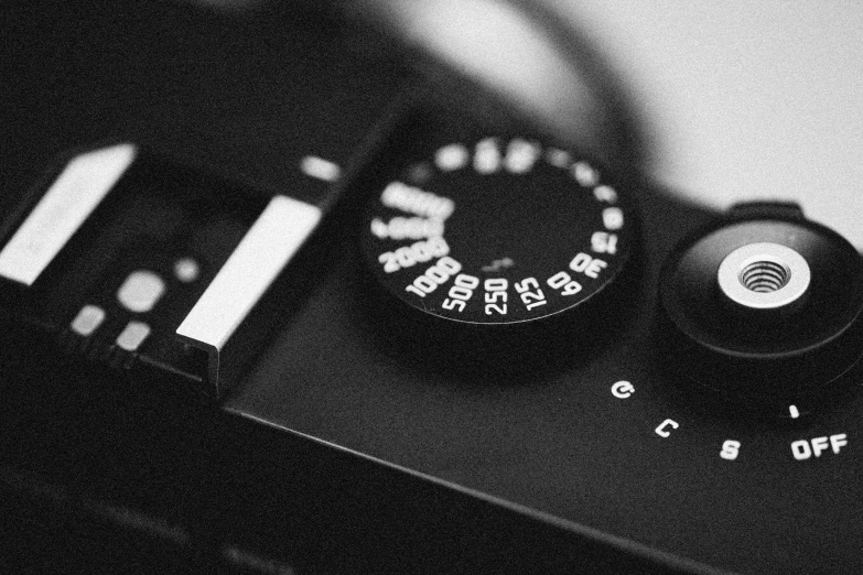 a black and white photo of a camera, a black and white photo, by Mathias Kollros, unsplash, dials, cinematic. by leng jun, photography photorealistic, low detailed