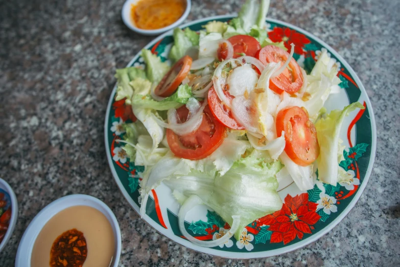 a close up of a plate of food on a table, hoang lap, lettuce, background image, local foods