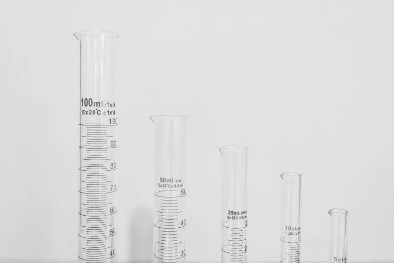 a group of test tubes sitting on top of a table, sense of scale, volume aesthetic, high quality product image”, listing image