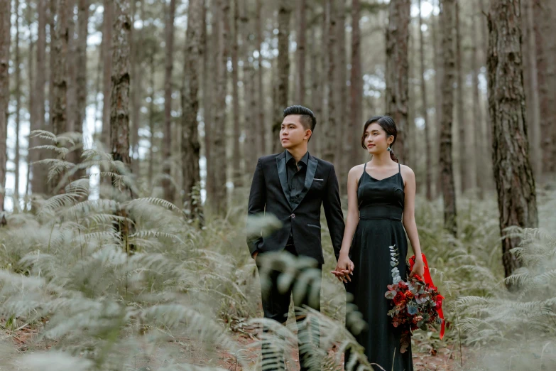 a man and woman standing next to each other in a forest, unsplash, neo-romanticism, ao dai, avatar image, outdoor photo, holiday