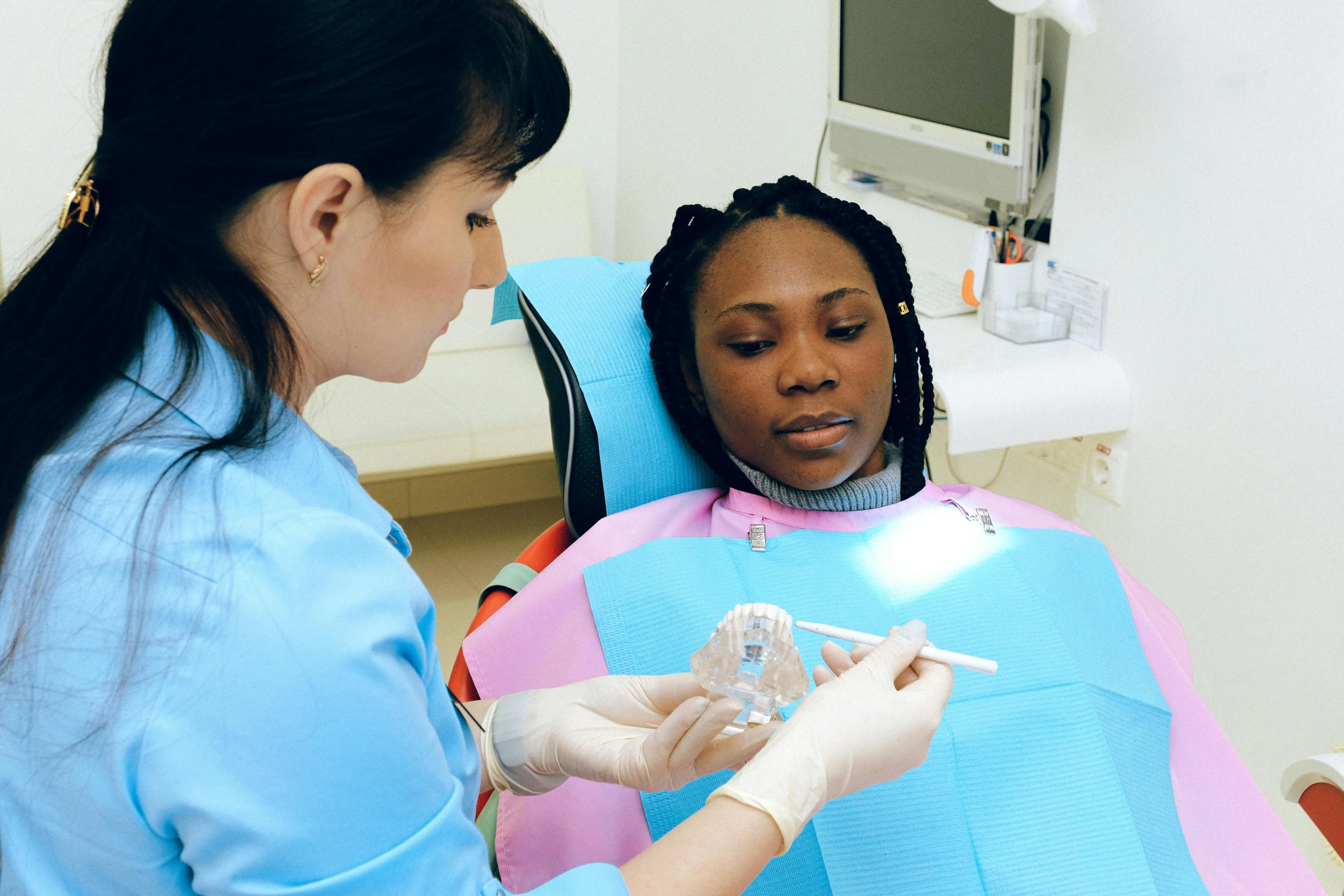 a woman getting her teeth checked by a dentist, pexels contest winner, hurufiyya, photo of a black woman, translucent, 15081959 21121991 01012000 4k, thumbnail