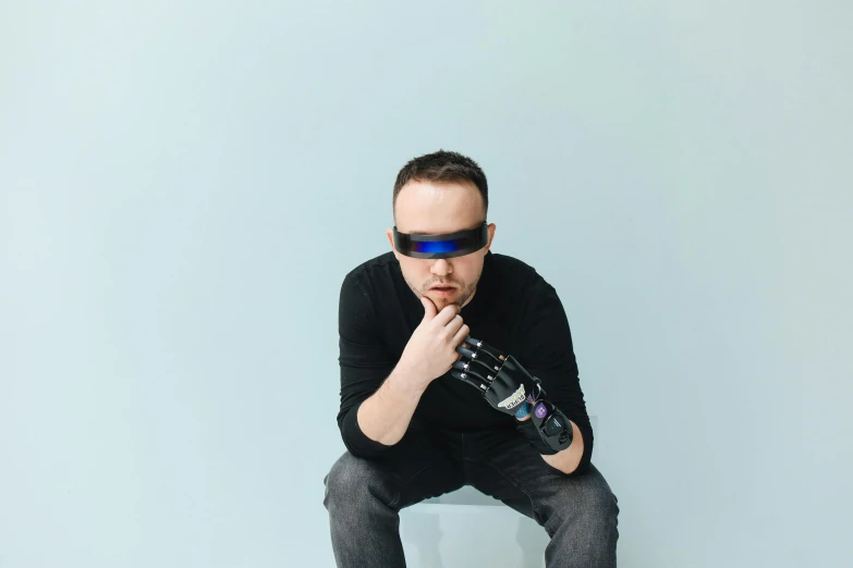 a man sitting on a toilet holding a bottle of water, unsplash, neo-dada, sleek oled blue visor for eyes, robotic prosthetic arm, wearing shiny black goggles, avatar image