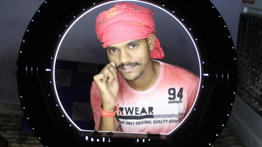 a man in a pink turban talking on a cell phone, a hologram, pexels contest winner, samikshavad, headshot profile picture, light stubble with red shirt, 2 3 years old, ((portrait))