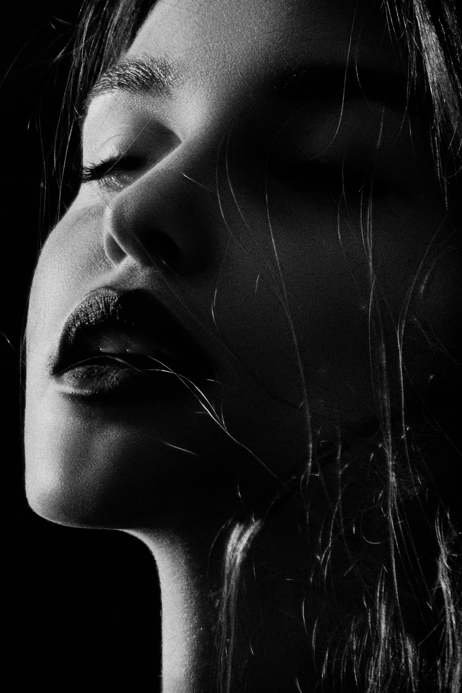 a black and white photo of a woman with her eyes closed, a black and white photo, by irakli nadar, trending on pexels, lips, a portrait of a suicidal girl, profile pic, carnal ) wet