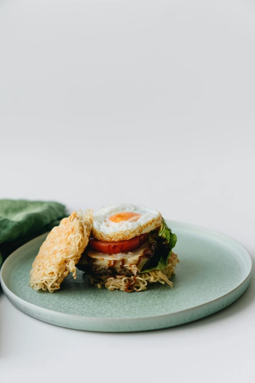 a close up of a plate of food on a table, an egg, profile image, crispy buns, full product shot