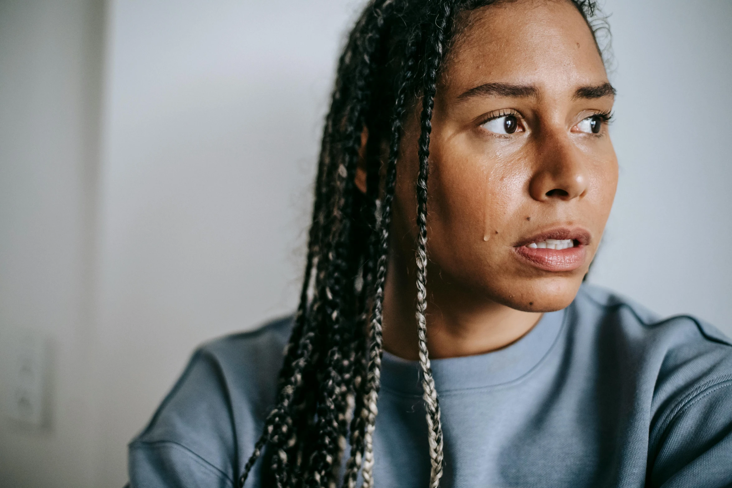 a close up of a person with long hair, a portrait, trending on pexels, hurufiyya, sweat drops, mixed-race woman, clinically depressed, lesbian