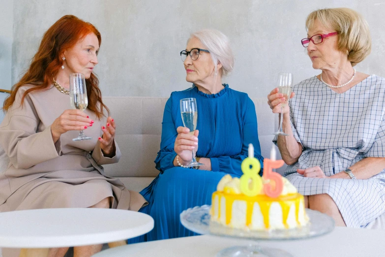 three women sitting on a couch holding wine glasses, pexels, holding a birthday cake, an old lady with red skin, multiple stories, pastel'