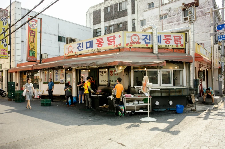 a group of people standing in front of a food stand, by Jang Seung-eop, sunny atmosphere, square, chuvabak, exterior photo