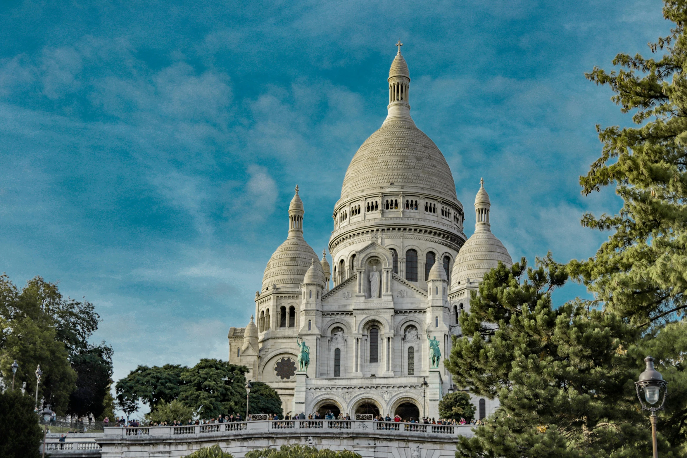 a large white building sitting on top of a lush green field, pexels contest winner, art nouveau, background basilica! sacre coeur, city views, brown, featured