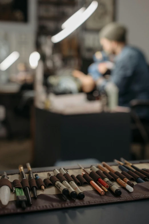 a bunch of tools sitting on top of a table, shaft studio, jacob & co, person in foreground, subtle detailing