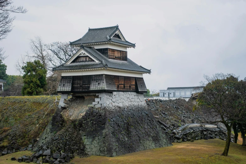a large building sitting on top of a hill, unsplash, sōsaku hanga, fortresses, museum photo, slight overcast weather, high detail photo