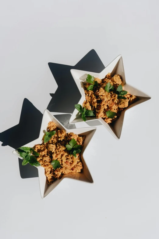 three bowls filled with food sitting on top of a table, tiny stars, award-winning render, te pae, alternate angle