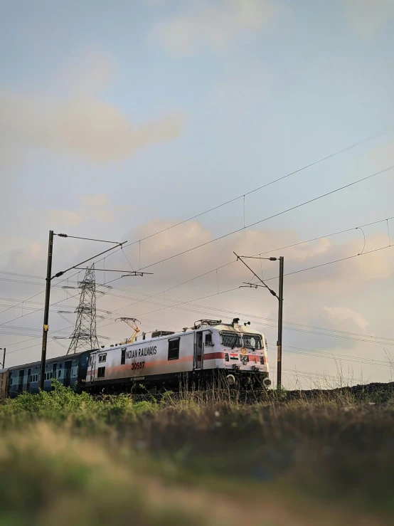 a large long train on a steel track, pexels contest winner, hyperrealism, indore, panorama shot, fan favorite, low quality photo