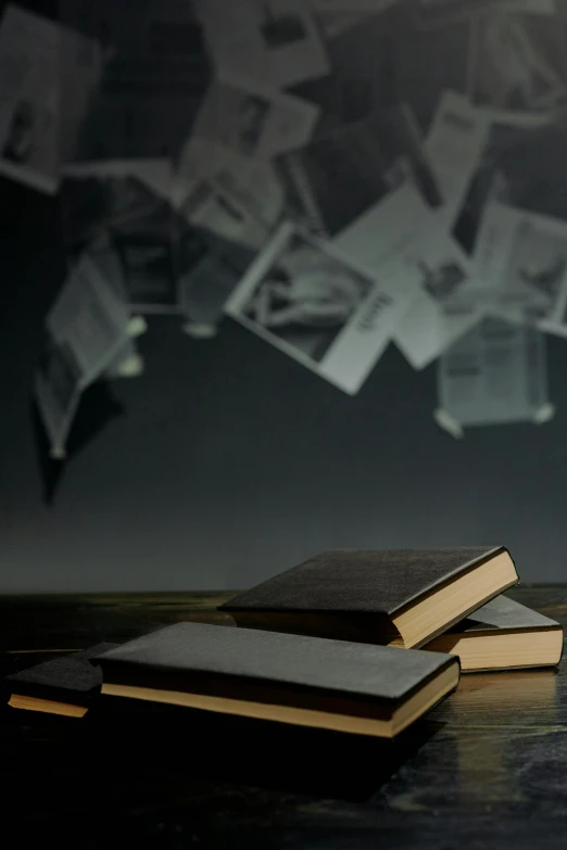 a stack of books sitting on top of a wooden table, an album cover, pexels contest winner, academic art, floating dust particles, background image, dark. no text, religious