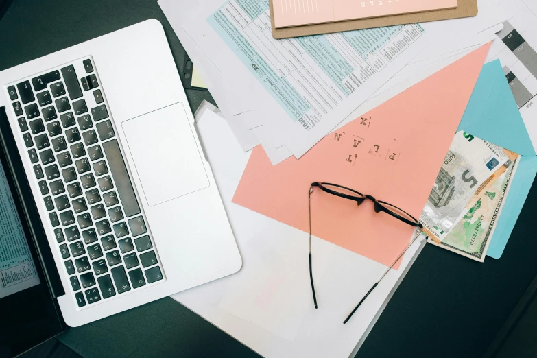 a laptop computer sitting on top of a desk, by Carey Morris, trending on unsplash, analytical art, sheet paper, glasses |, 9 9 designs, various posed