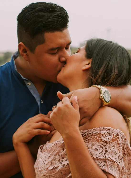 a man kissing a woman on the cheek, a picture, pexels contest winner, latina, holding each other, profile image, watch photo