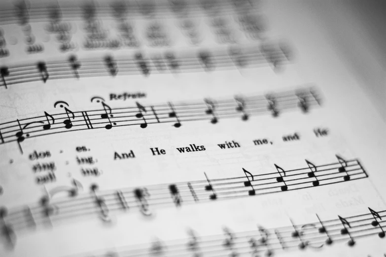 a black and white photo of a sheet of music, by Daniel Lieske, pexels, the lord and savior, a brightly coloured, biblical image, sing with me