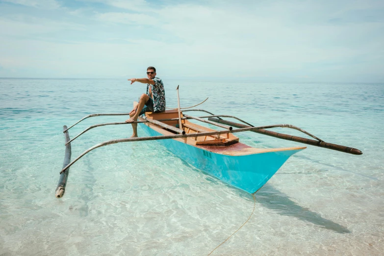 a man sitting on top of a boat in the ocean, shallow water, avatar image, manila, high-resolution photo