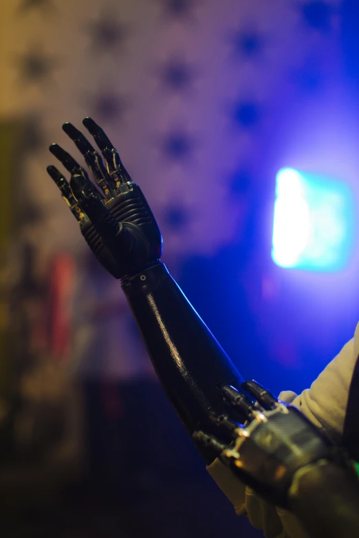 a close up of a person with a glove on, by Jason Felix, robotic prosthetic limbs, in a nightclub, arms out, sideshow collectibles