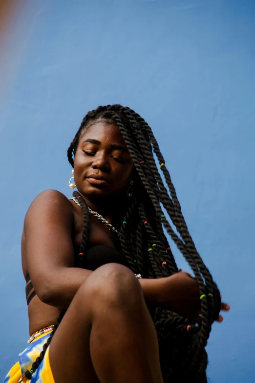 a woman with dreadlocks sitting on a rock, trending on pexels, black arts movement, two long braids blue, plain background, summer sky, thick lines