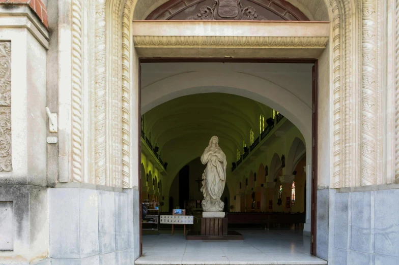 a red fire hydrant sitting in front of a building, a statue, by Cagnaccio di San Pietro, visual art, the narthex, white sweeping arches, manila, portait image