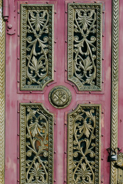 a close up of a pink door on a building, inspired by Carlo Crivelli, flickr, made of intricate metal and wood, close - ups, mane