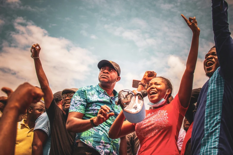 a group of people with arms in the air, by Ingrida Kadaka, pexels contest winner, happening, epic 3 d omolu, politicians, smug look, protest