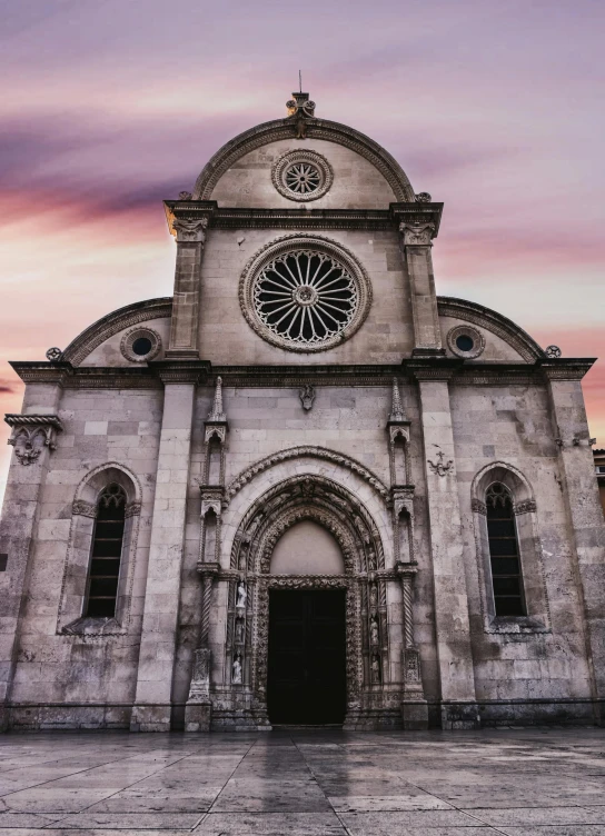 a church with a clock on the front of it, by Kristian Kreković, pexels contest winner, romanesque, dark grey and orange colours, square, split near the left, saturno buttò