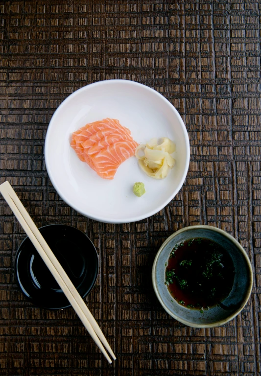 a close up of a plate of food with chopsticks, a still life, inspired by Kanō Shōsenin, unsplash, sōsaku hanga, salmon khoshroo, hyperrealistic”, hyperrealistic ”