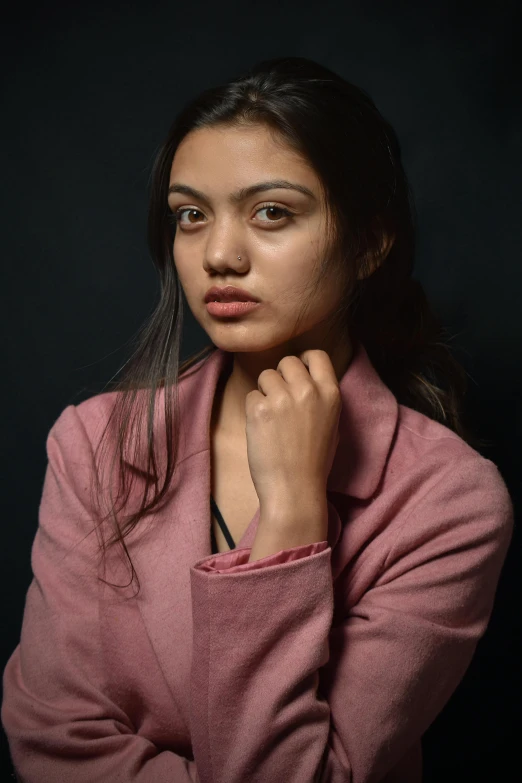 a woman in a pink jacket posing for a picture, hyperrealism, olive skin, serious focussed look, studio photoshoot, nivanh chanthara