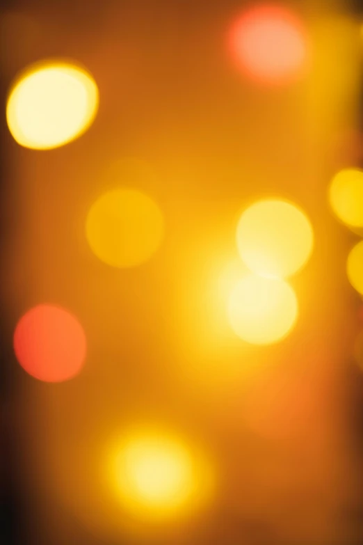 a blurry photo of a bunch of lights, by James Bard, gold dappled light, istockphoto, gradient yellow to red, - n 9