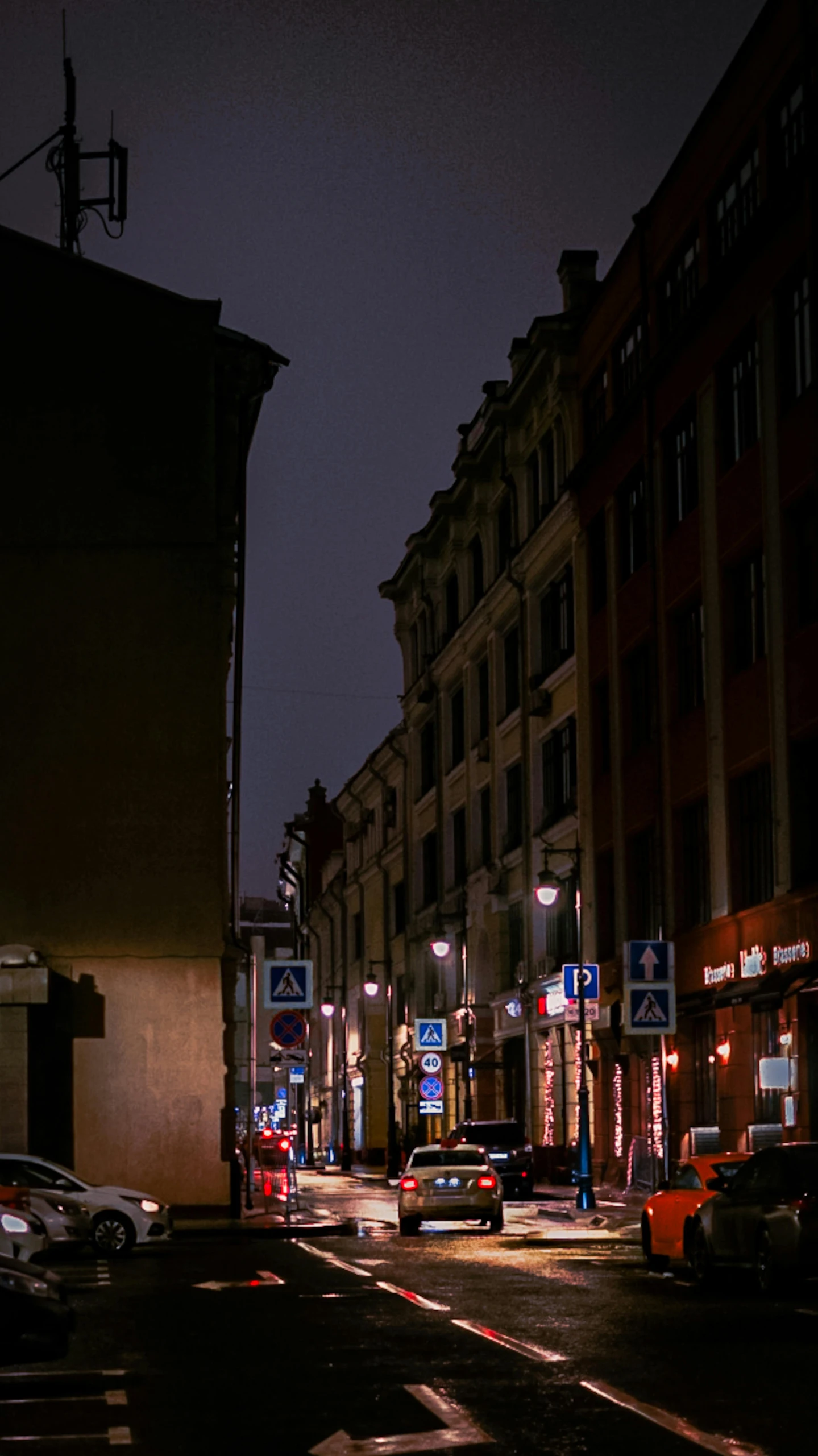 a city street filled with lots of traffic at night, by Tamas Galambos, pexels contest winner, renaissance, empty metropolitan street, saint petersburg, storefronts, night time footage