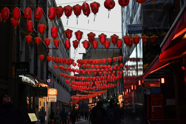 a city street filled with lots of red lanterns, a photo, in london, 🦩🪐🐞👩🏻🦳, taken in the late 2010s, the best ever