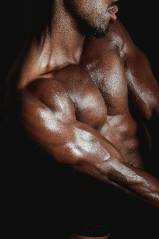 a man flexing his muscles against a black background, pexels contest winner, hyperrealism, brown skin, bulging veins, low quality photo, steroid use