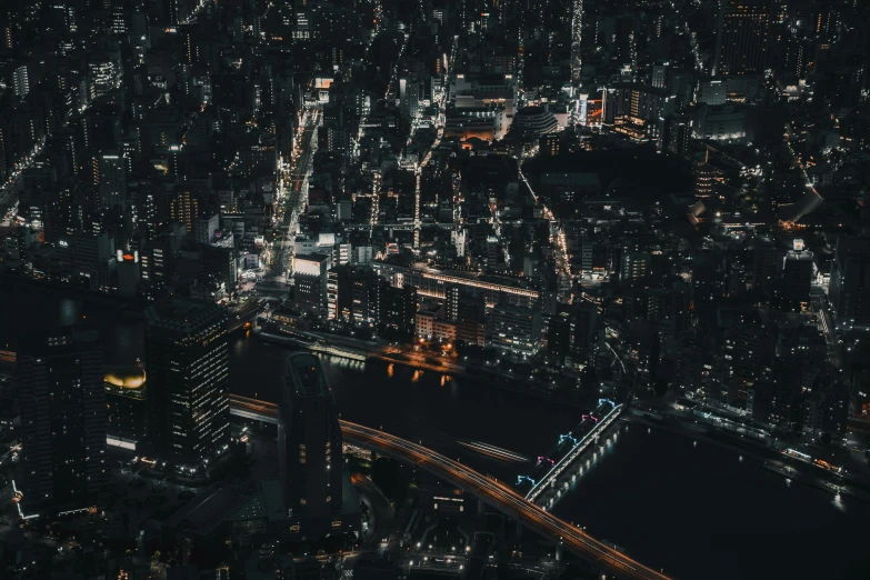 an aerial view of a city at night, pexels contest winner, trending in japan, hyperdetailed!, iphone wallpaper, with a black dark background