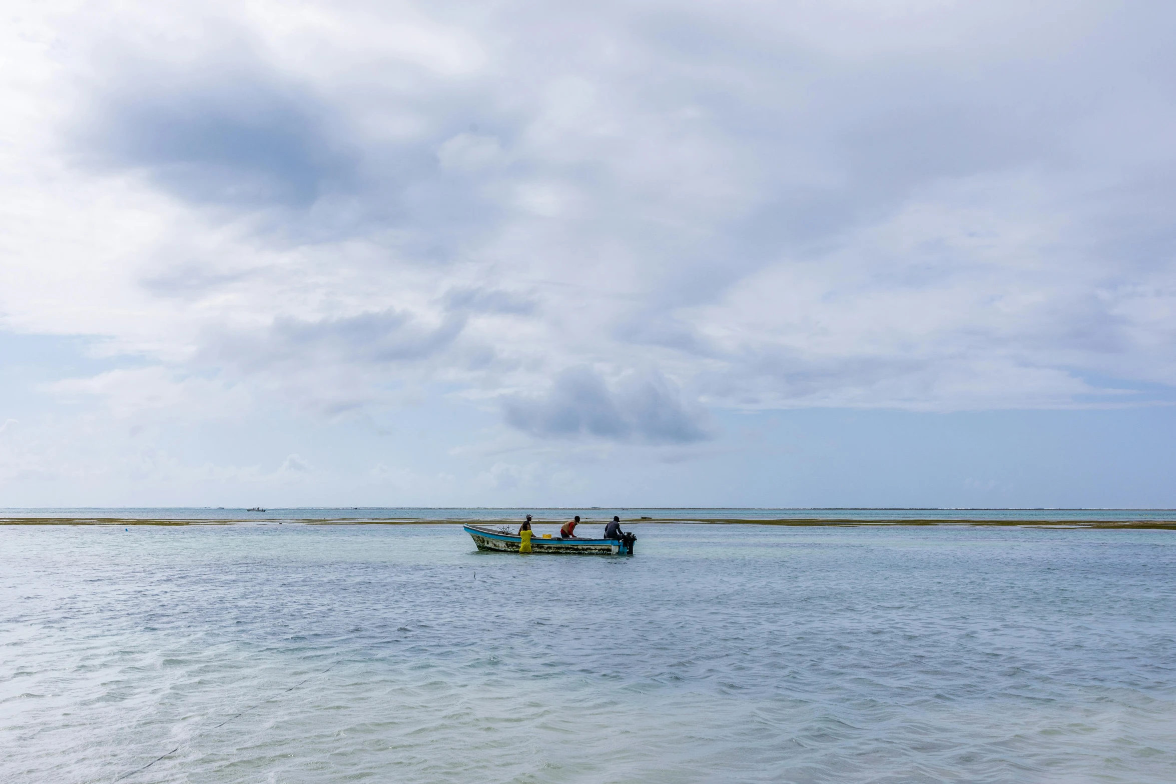 a couple of people on a small boat in the water, by Jessie Algie, pexels contest winner, hurufiyya, panoramic shot, sea ground, fishing, slight overcast weather