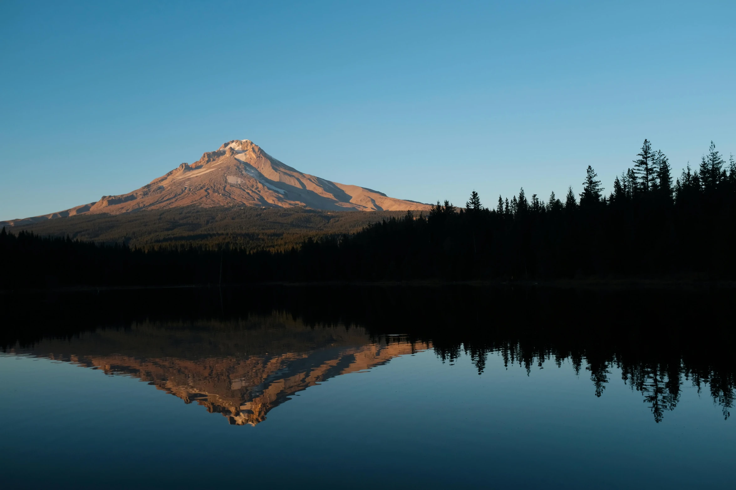 a mountain reflected in the water of a lake, slide show, fan favorite, dimly lit, oregon